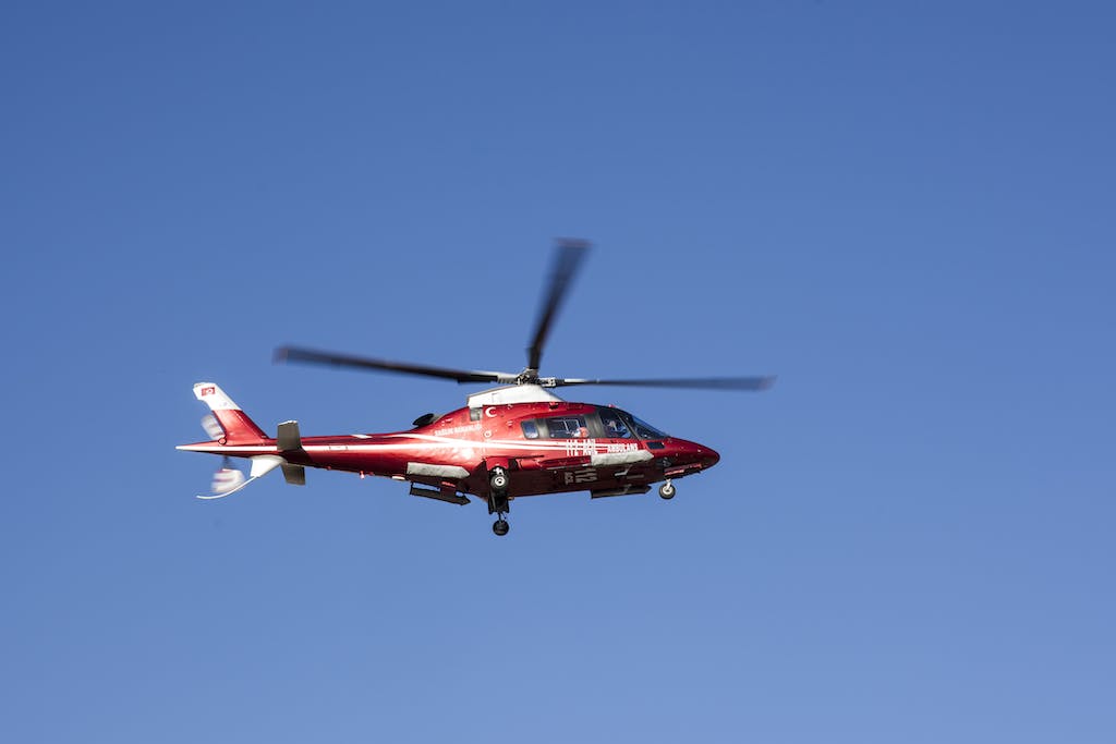 Flying Red and White Helicopter